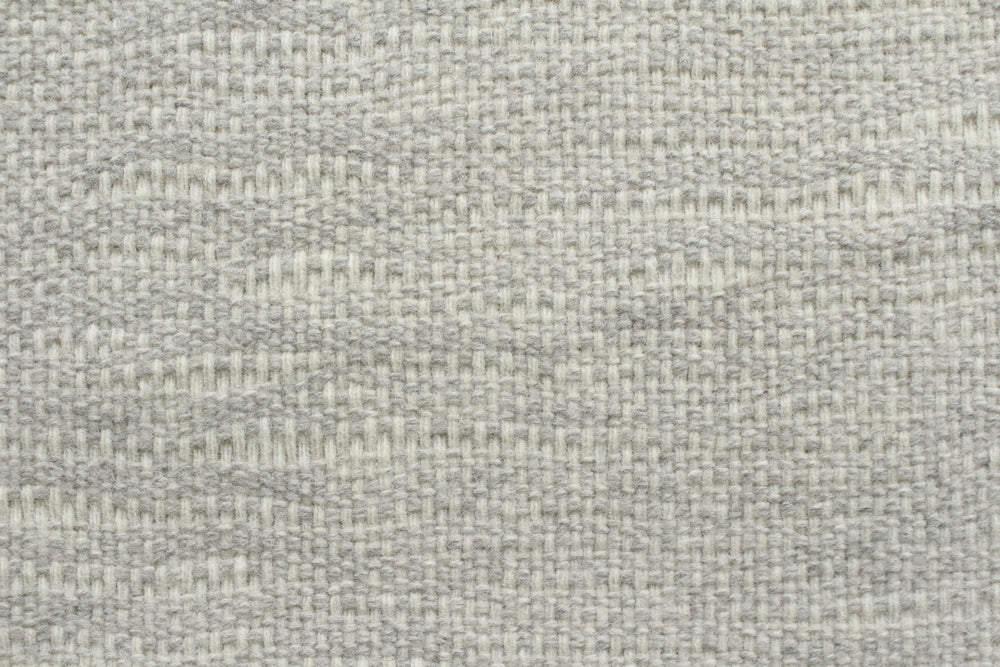 Close-up of a textured gray fabric surface