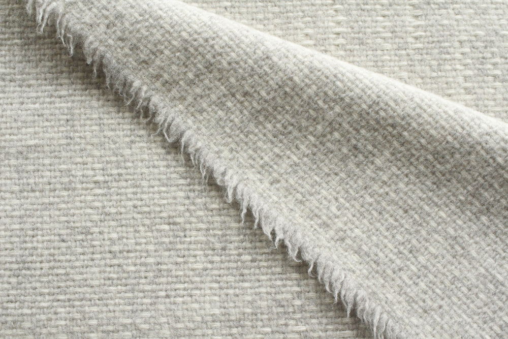 Close-up of textured light gray fabric
